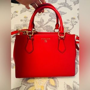 Never uses gorgeous red Michael Kors purse